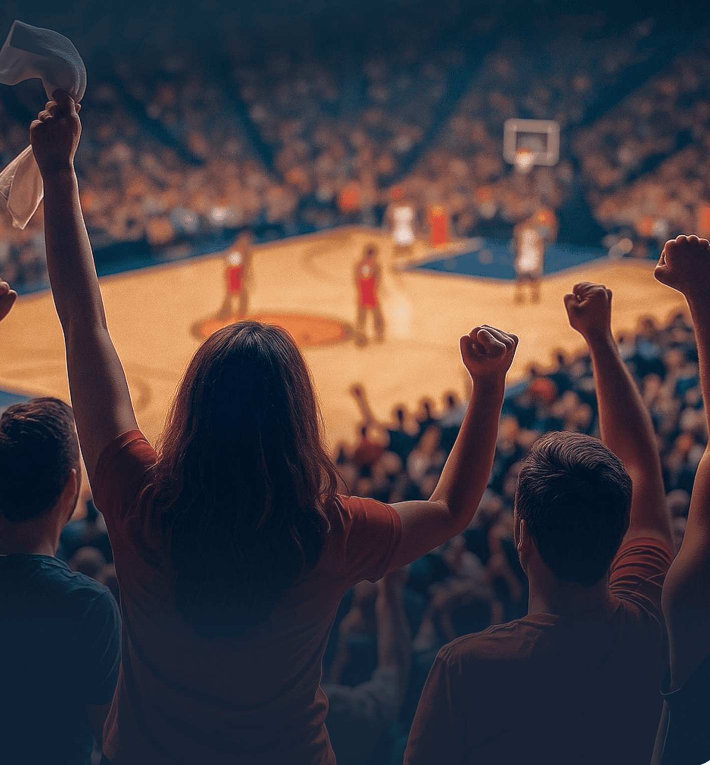 Fans cheering from the stands at a basketball game